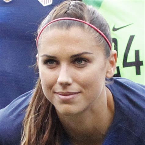 US soccer star Alex Morgan shows off her firm rump in a thong bikini in these pictures from the 2014 Sports Illustrated swimsuit issue. Though Alex Morgan looks like she has headed a few too many soccer balls with her face, her hindquarters appear to be quite powerful. 